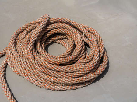 On the deck of the ship, ship rope are rolled into coil for mooring the ship.
