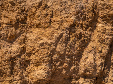 Background. Stone wall with beautiful natural texture.