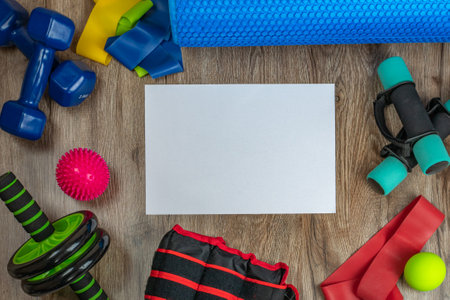 Sports and training equipment for fitness and physical education. Dumbbells, fitness roller, spiky and smooth acupuncture balls, ab and back roller, elastic bands. Concept of active lifestyleの写真素材