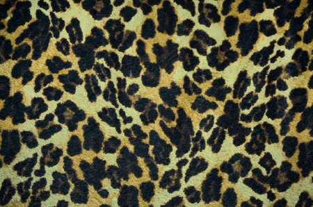 Brown and black leopard pattern. Animal fur as background.