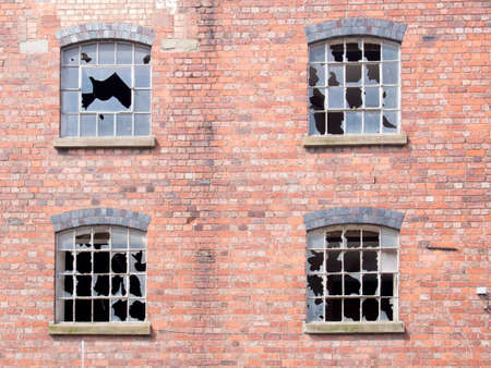 Old building with broken windowsの写真素材