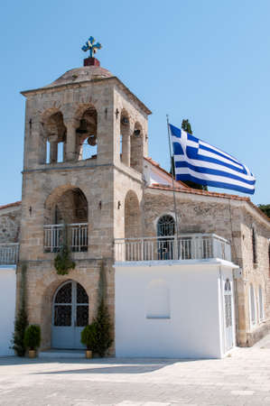 Greek Church with the national flag flying outsideの写真素材