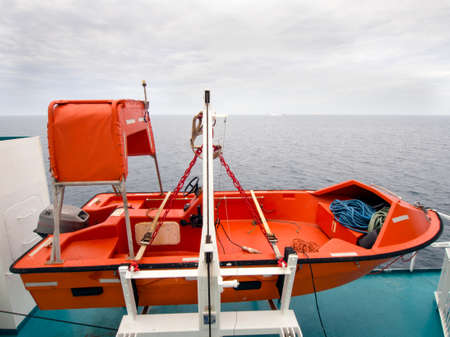 Small life boat on a ferryの写真素材