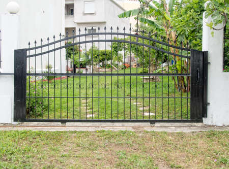 Steel security gates protecting house