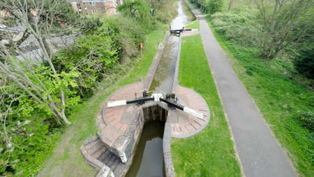 Aerial image of a peaceful canal lock with a small towpath along side.の写真素材