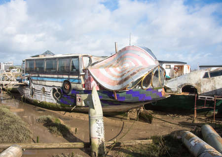 SHOREHAM-ON-SEA ,UK - FEBRUARY 6 2016 : Old barge converted into a house boat with part of a bus in the design.のeditorial素材