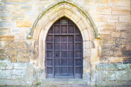 Wooden Church Door on the outside of a churchの写真素材