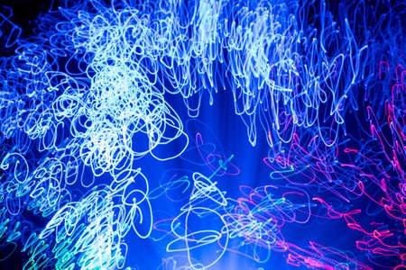 Trails of light from de focused blue and red  lights from a fibre optic lamp