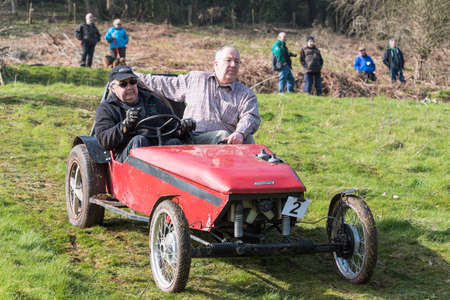 Worcester , UK - March 13 2016 : Competitors take part in a hill climb to see who can drive their car furthest up a muddy hillside. This was a free to enter event with no photography restrictions.のeditorial素材