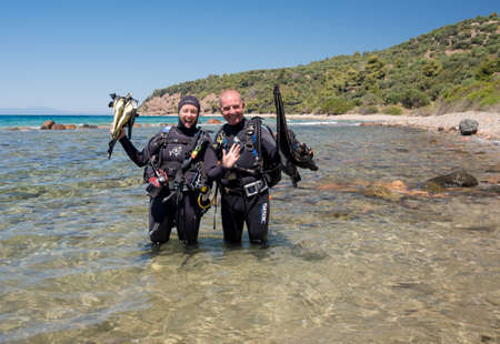 Avlaki,Greece - June 15 2006 : Two scuba divers ready to dive at a local dive site.のeditorial素材
