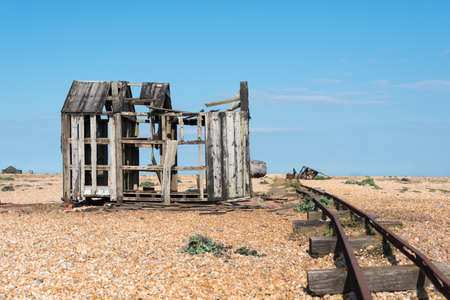 Old wooden boat fishing boat and a shed falling into ruins.の写真素材