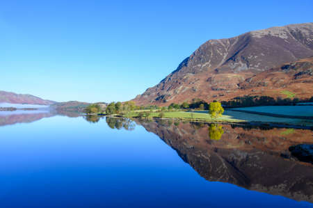 View of Grasmoor Fell across Crummock Water in the lake District,Cumbria,UKの写真素材