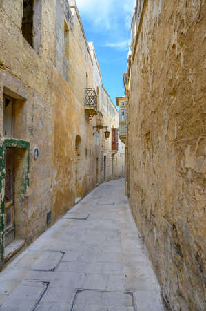 Narrow street in the ancient Maltese city of Mdina on the island of Malta.の写真素材