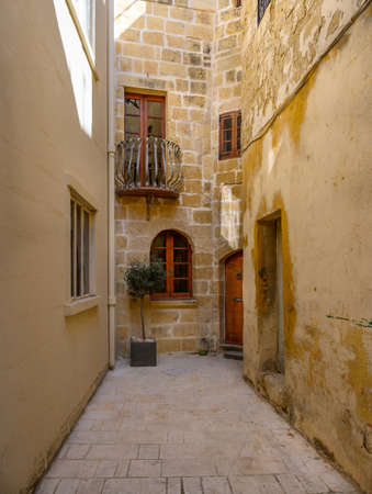 Quiet residential stree in the ancient Maltese city of Mdina on the island of Malta.の写真素材