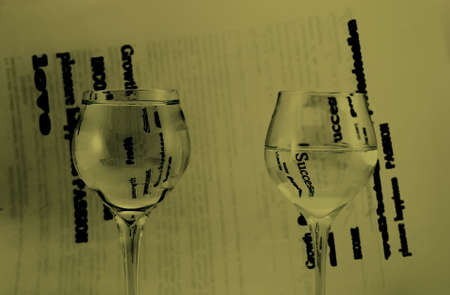 Two glasses with water, black and white background.の写真素材