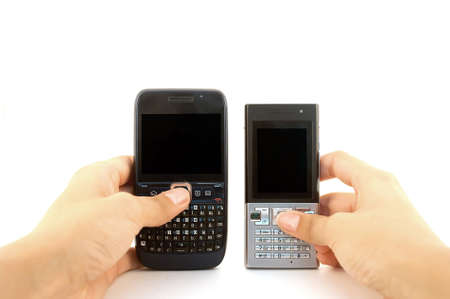 Two mobile phones in hands over white