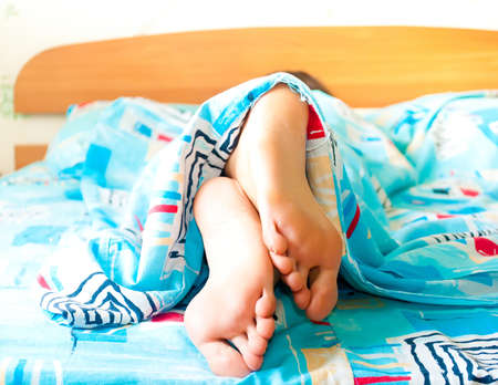 Sleeping woman's cute feetの写真素材
