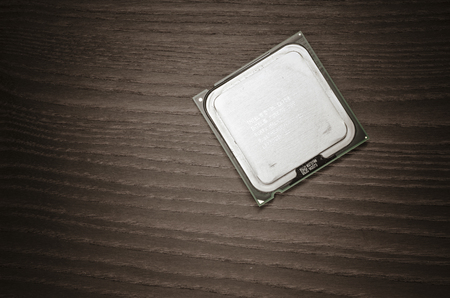 Intel Core 2 Duo cpu front, close up on a wooden backgroundのeditorial素材
