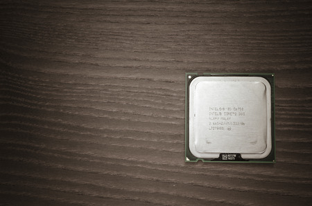 Intel Core 2 Duo cpu front, close up on a wooden backgroundのeditorial素材