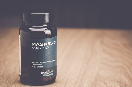 Inverigo, Italy - September 8, 2016: marine magnesium citrate tablets Bios Line nutritional supplement in a glass bottleのeditorial素材