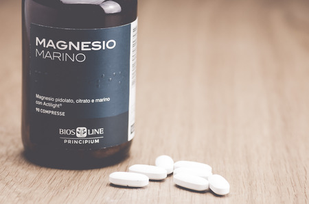 Inverigo, Italy - September 9, 2016: marine magnesium citrate tablets Bios Line nutritional supplement in a glass bottleのeditorial素材