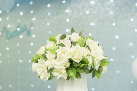 Two tier cake on blue background with unfocused lightsの写真素材