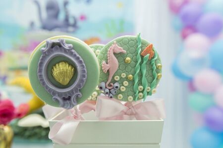 Children's party decoration - lollipop with seabed elements - seahorse, oyster, coral, fish and seaweed.の写真素材