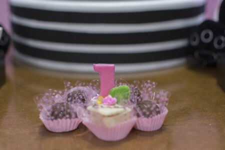 Girl birthday party decoration detail Panda theme. Wonderful sweets, cupcakes, cake, boxes and designs. 1 year old birthday. Cute girl party decoration.Selective focus.の写真素材