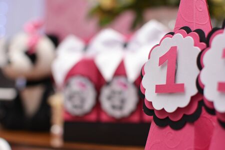 Girl birthday party decoration detail Panda theme. Wonderful sweets, cupcakes, cake, boxes and...