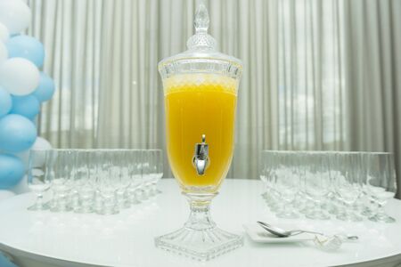 Boy's birthday party with bluish pastel colors decoration. Decor with aviator theme with teddy bear, clouds, candy. Delicate candy table with beautiful decorated cake.の写真素材