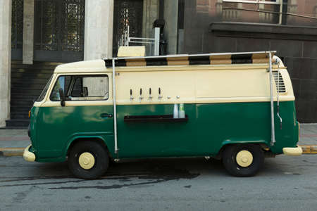 Florianopolis, Brazil - February 22, 2020: Side view of isolated food truck of beer taps in a vintage green and beige van. Food trucks is an alternative and current business model.のeditorial素材