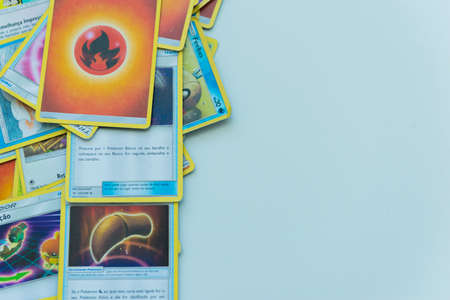 Florianopolis, Brazil, July 13, 2019: close-up of a man hand holding Pokemon Cards. Brazilian youths perform battles using these collectibles cards.のeditorial素材