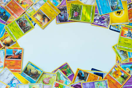 Florianopolis, Brazil, July 13, 2019: close-up of a man hand holding Pokemon Cards. Brazilian youths perform battles using these collectibles cards.のeditorial素材