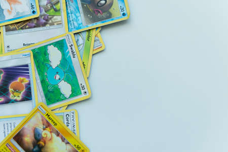 Florianopolis - Brazil, July 12, 2019: Pokemon cards distributed on the white table. Brazilian youth perform battles using these collectible cardsのeditorial素材