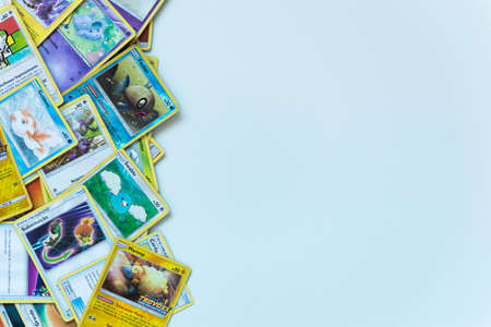 Florianopolis - Brazil, July 12, 2019: Pokemon cards distributed on the white table. Brazilian youth perform battles using these collectible cardsのeditorial素材