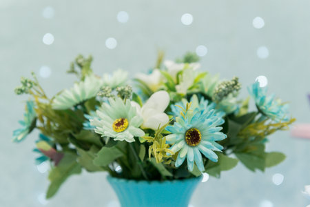 Two tier cake on blue background with unfocused lightsの写真素材