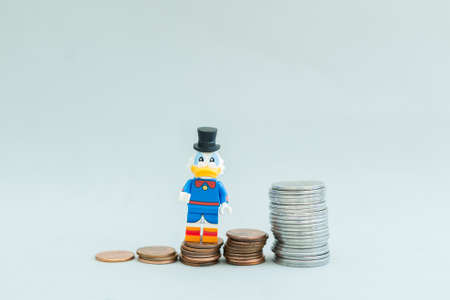 FlorianÃ³polis - Brazil, July 9, 2019: Minifigure of Scrooge McDuck above the stack of golden coins. Lego minifigures are manufactured by The Lego Group.のeditorial素材