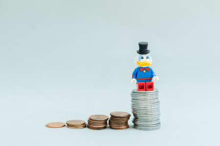FlorianÃ³polis - Brazil, July 9, 2019: Minifigure of Scrooge McDuck above the stack of golden coins. Lego minifigures are manufactured by The Lego Group.のeditorial素材