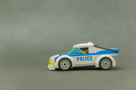 Bauru, Brazil. September 15, 2019. Lego minifigure of police officer driving police car. Police patrol is important for the found for offenders. Lego minifigures are manufactured by The Lego Group.のeditorial素材