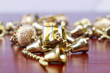 Christmas presents with bells and balls and pearls all over