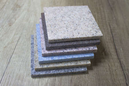 sample acrylic artificial stone on a wooden table
