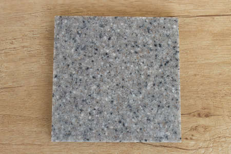 sample acrylic artificial stone on a wooden table