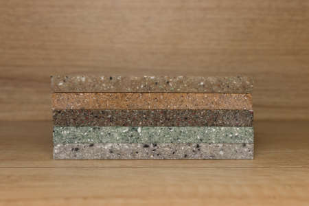 sample acrylic artificial stone on a wooden tableの写真素材