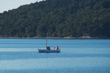 Fisherman at the seaの写真素材