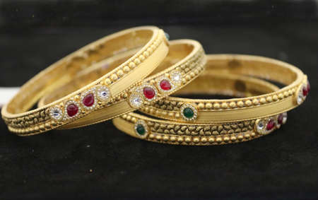Two Bangles Or Kadas Or Kangan places on a surface being focusedの写真素材