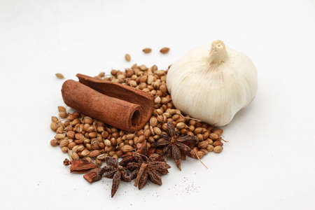 Black Pepper,Cinnamon, Anise and white onion on a board の写真素材