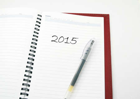 A pen on a book with phrase 2015の写真素材