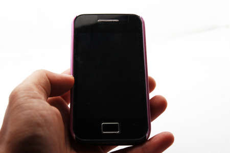 Holding a android phoneの写真素材