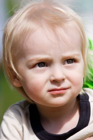 Little boy in outdoor sittings