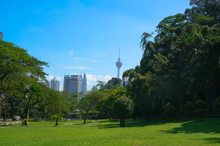 City park with modern buildings in Downtown of Kuala Lumpurの写真素材